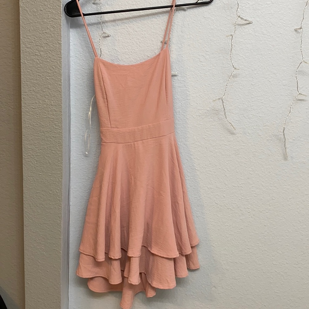 Woman’s pink dress